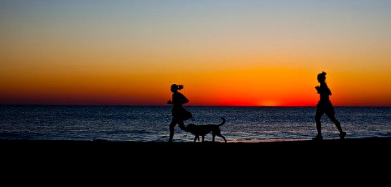 Runners at sunrise along the beach in Rehoboth Beach, Del. (Photo by Owen Byrne/flickr)