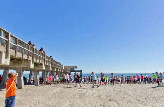 Runners make their way along the beach at the Critz Tybee Run Fest. (Courtesy Critz Tybee Run Fest)