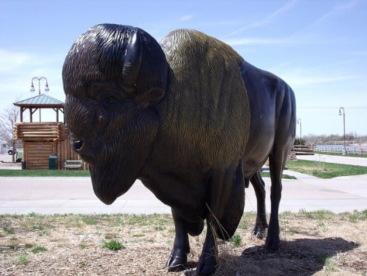 Statue of a buffalo in front of the Great Platte River Road Archway in Kearney, Nebraska. (Photo by Danzil Raines/flickr)