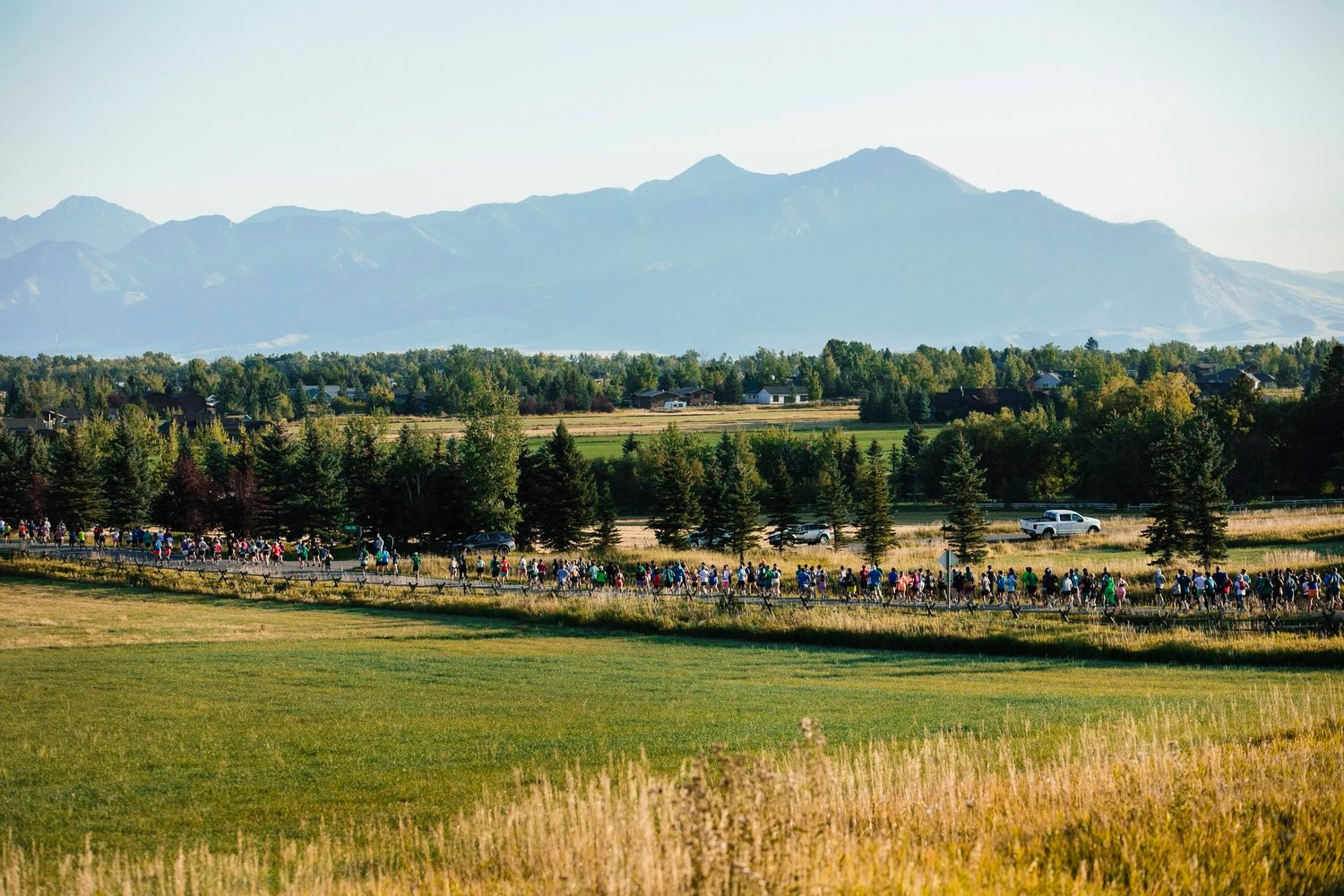 runners in front of the mountain during the bozeman's fall half marathon