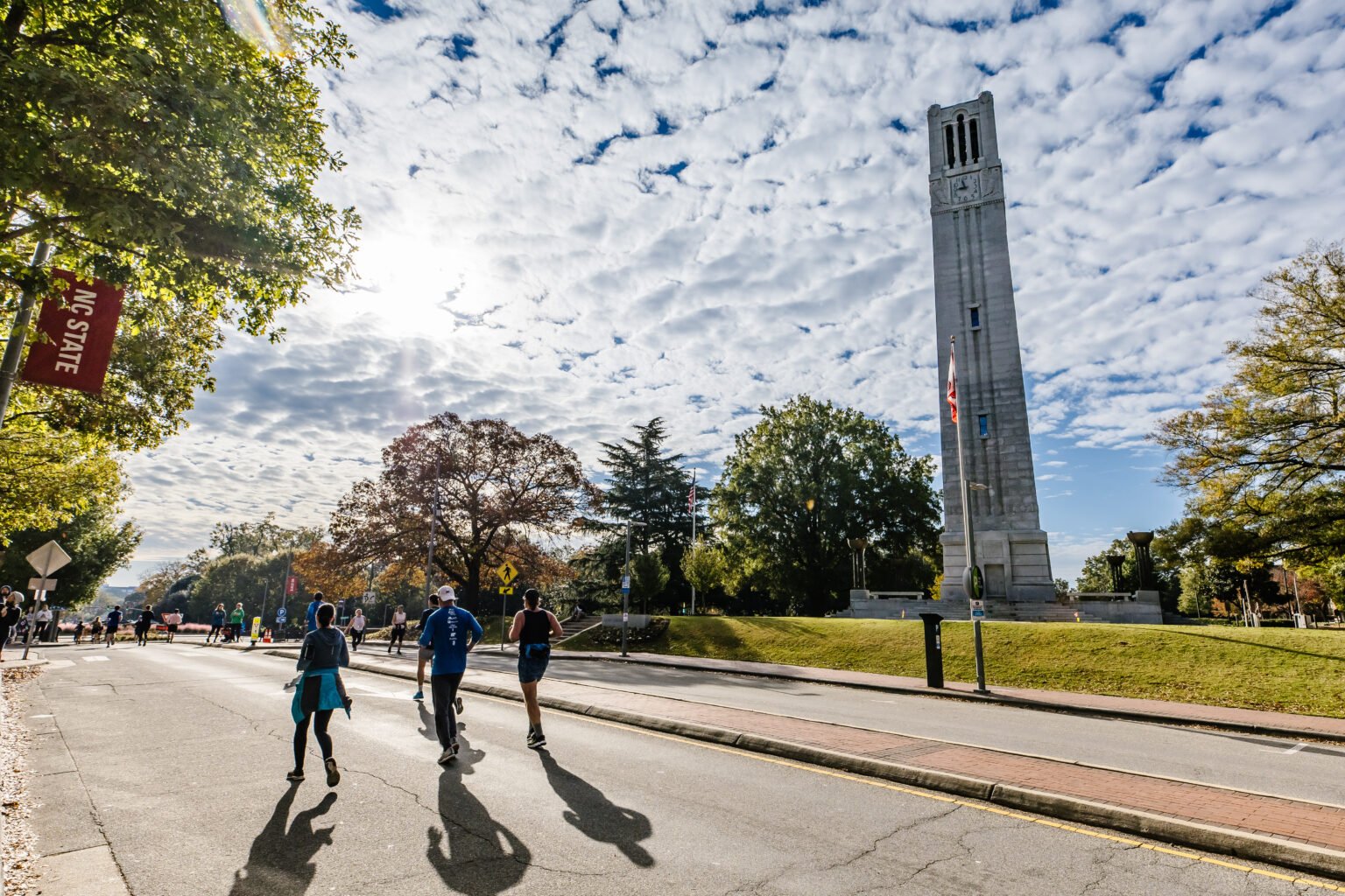 runners passing landmarks in the Raleigh City of Oaks fall Half Marathon