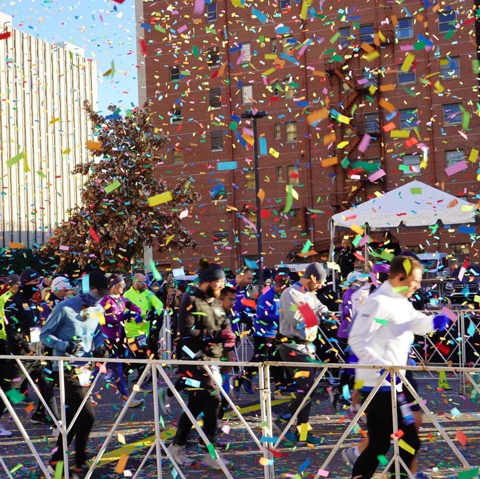 runners with confetti in the route 66 half marathon in tulsa